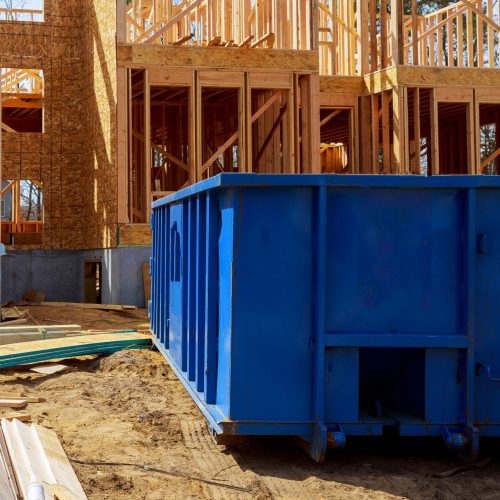 Old and used construction material in the new building construction work site. Commercial Dumpster Rentals in Denver Colorado